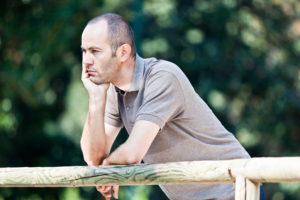 Pensive Adult Man at Park